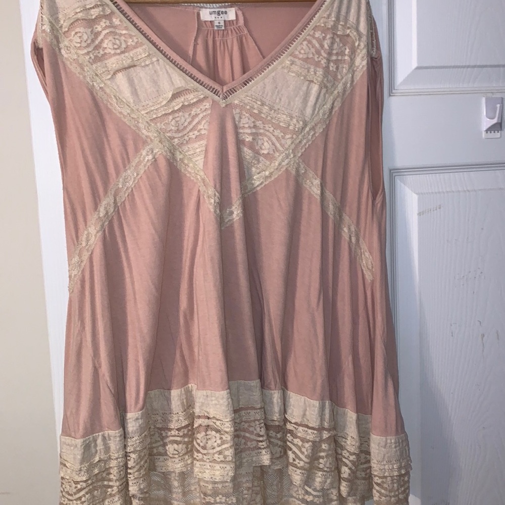 Small umgee shirt fits like a large so comfortable just didn’t wear it anymore